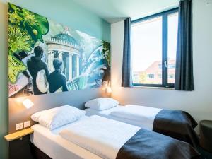 Gulta vai gultas numurā naktsmītnē B&B Hotel München-Trudering