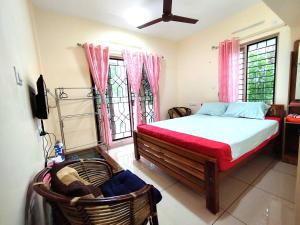 Krevet ili kreveti u jedinici u objektu GREENVIEW HOMESTAY KOVALAM