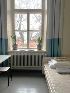 Posteľ alebo postele v izbe v ubytovaní Hostel Suomenlinna