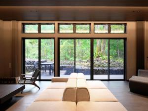 Rúm í herbergi á Rakuten STAY VILLA Nikko