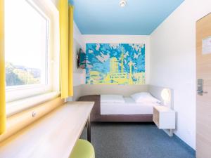 Krevet ili kreveti u jedinici u objektu B&B Hotel Stuttgart-City