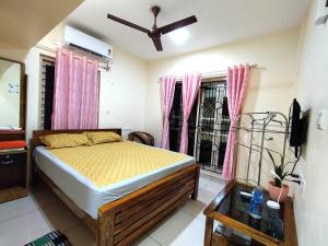 Krevet ili kreveti u jedinici u objektu GREENVIEW HOMESTAY KOVALAM