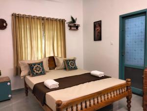 Guestland Homestay में एक कमरे में एक या कई बेड