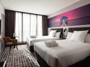 Кровать или кровати в номере Novotel Perth Murray Street