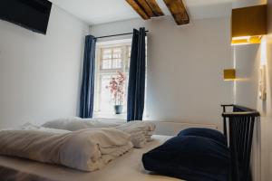 Voodi või voodid majutusasutuse Capsule Hotel Nyhavn63 toas