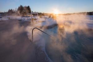 a hot tub with steam coming out of it at Estérel Resort in Esterel