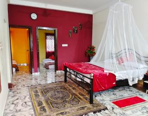 Katil atau katil-katil dalam bilik di Mannat Inn Homestay (Mysore)