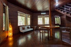 A seating area at RedDoorz Resort @ Taman Wisata Mangrove