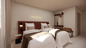 a bedroom with three beds with white sheets at Adonis le Castellet in Signes