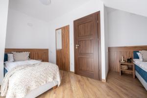 Postel nebo postele na pokoji v ubytování Para Apartments - Dwupoziomowe Apartamenty