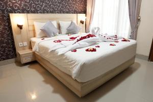 A bed or beds in a room at North Wing Canggu Resort