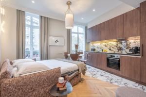 A kitchen or kitchenette at Yuna Saint-Germain-des-Prés - Serviced Apartments