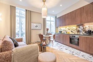 A kitchen or kitchenette at Yuna Saint-Germain-des-Prés - Serviced Apartments