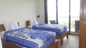 Cama ou camas em um quarto em Jukung Dive Resort Bali PENIDA