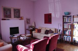 a living room with a couch and a tv at Teodora B&B in Milan