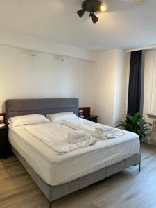 Cama ou camas em um quarto em 24-7 Stadthotel Stuttgart