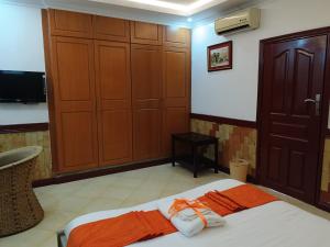 Tempat tidur dalam kamar di Hotel Double N - Kisumu