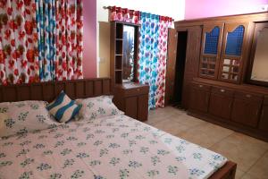 Tempat tidur dalam kamar di CITADEL HOLIDAY HOME