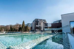 a swimming pool on the roof of a building at Silver Mountain, Poiana Brasov - Forest Crib in Braşov