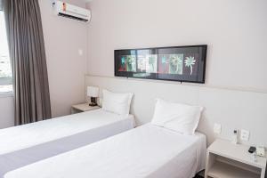 Posteľ alebo postele v izbe v ubytovaní Hotel Eldorado Flat