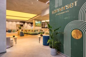 a lobby with couches and a waiting room at Somerset Schönbrunn Vienna in Vienna