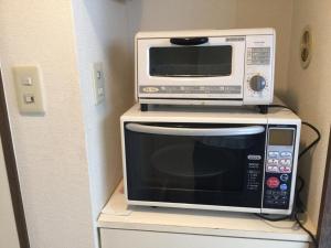 A cozinha ou kitchenette de Business Inn Grandeur Fuchu