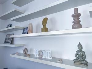 a room with white shelves with items on them at Domus Montebello in Rome