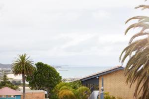 a view of the ocean from a house at Holiday Lodge Motor Inn in Narooma