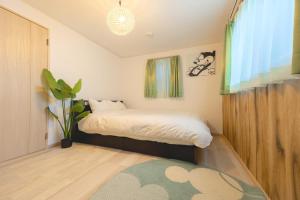 Кровать или кровати в номере CuteFamilyHouse! 8min Shinjuku 5minJR 3minSubway Cozy,Quiet KidsFree Under6yrs