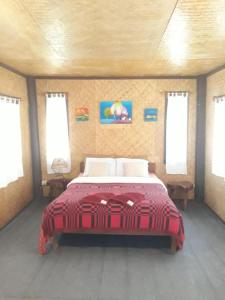 A bed or beds in a room at Bueng Pai Farm บึงปายฟาร์ม