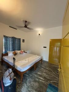 Barefoot Hostels, Varkala tesisinde bir odada yatak veya yataklar