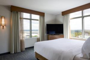 A bed or beds in a room at Residence Inn Arlington Capital View