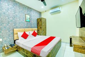 Hotel O Grace Villa में एक कमरे में एक या कई बेड