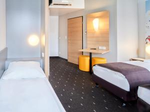 Gulta vai gultas numurā naktsmītnē B&B Hotel Mainz-Hbf