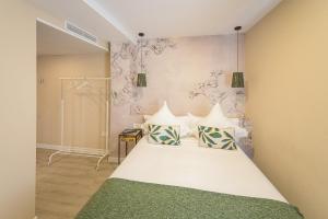 Ліжко або ліжка в номері Hostal Plaza Boutique - Solo adultos