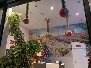 a room with christmas ornaments on the wall at Hotel BESTPRICE Alcalá in Madrid