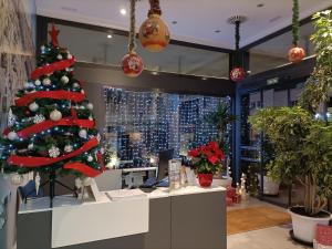 a christmas tree is on display in a store at Hotel BESTPRICE Alcalá in Madrid