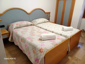 Кровать или кровати в номере AlmaMed Hotel san Leonardo