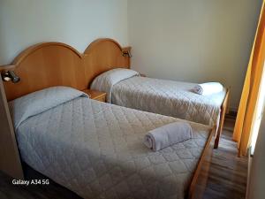 Кровать или кровати в номере AlmaMed Hotel san Leonardo