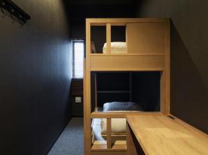 Una cama o camas en una habitación de 9 C Hotel Asahikawa