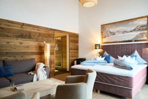 Cama ou camas em um quarto em Hotel Alpennest