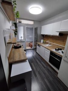 A kitchen or kitchenette at Prievidza Home