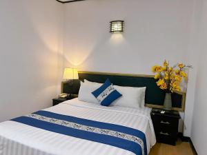 Posteľ alebo postele v izbe v ubytovaní New Star Inn Boutique Hotel-Near Bến Thành Market