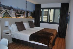 A bed or beds in a room at Hotel BESTPRICE Gracia