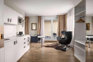 A television and/or entertainment centre at Amedia Luxury Suites Graz, Trademark Collection by Wyndham