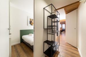 A bed or beds in a room at La Fruitiere - IMMODREAMS - Avoriaz