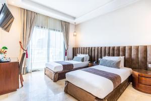 A bed or beds in a room at One Hotel Casablanca