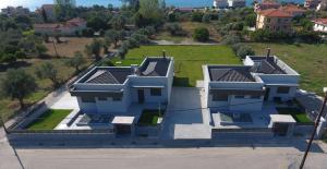 an aerial view of a house with a yard at Nostos Luxury Villas with Private Pool in Nafpaktos in Nafpaktos