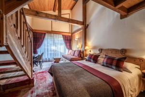 Кровать или кровати в номере Hotel Le Samoyede