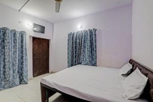 Gracious Guest House tesisinde bir odada yatak veya yataklar